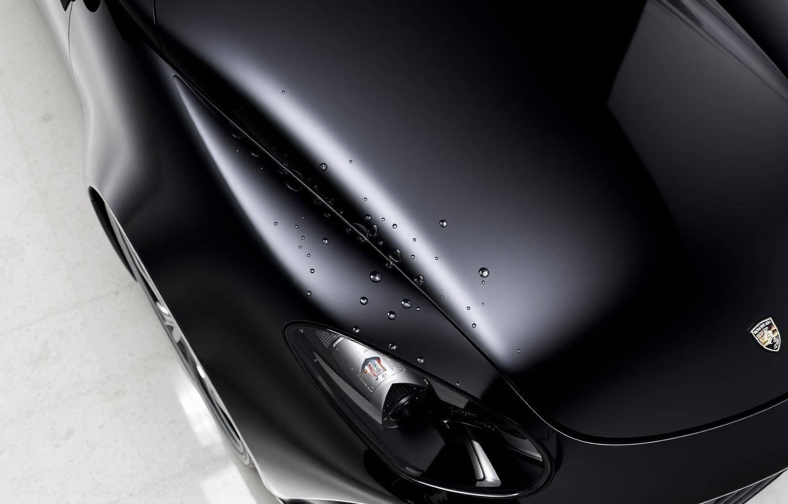 Black sports car with ceramic coating water beading